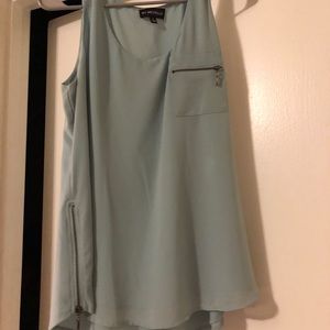 Light blue sleeveless blouse with zipper accents